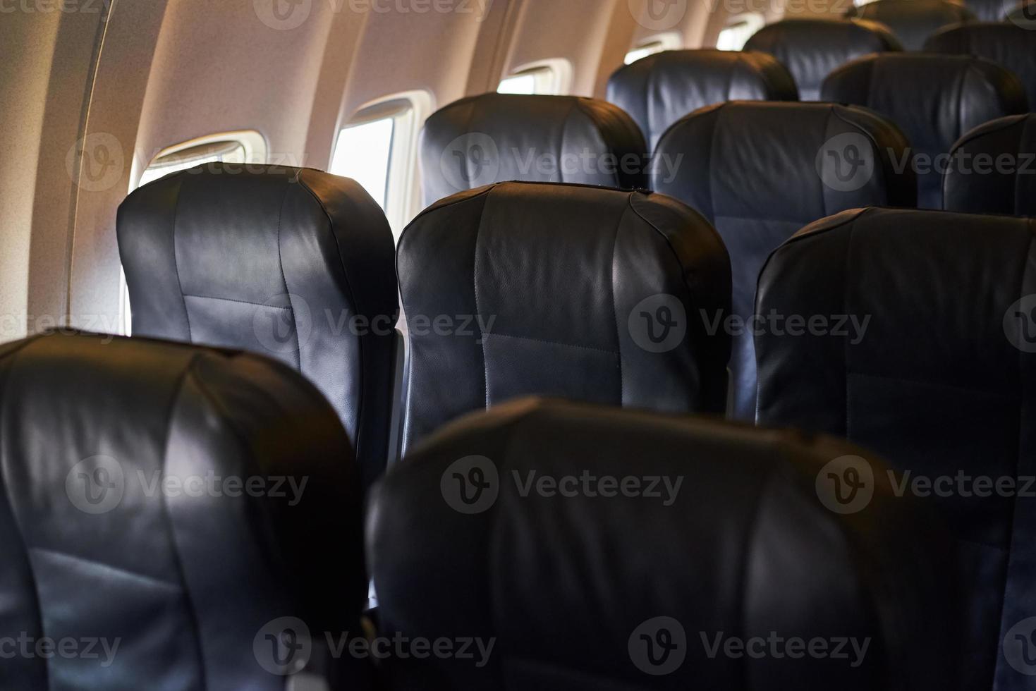 Empty airplane passenger seats in airplane. A plane interior photo
