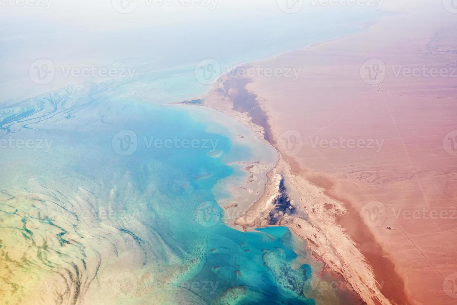 Aerial view of turquoise sea coast and a sandy beach photo