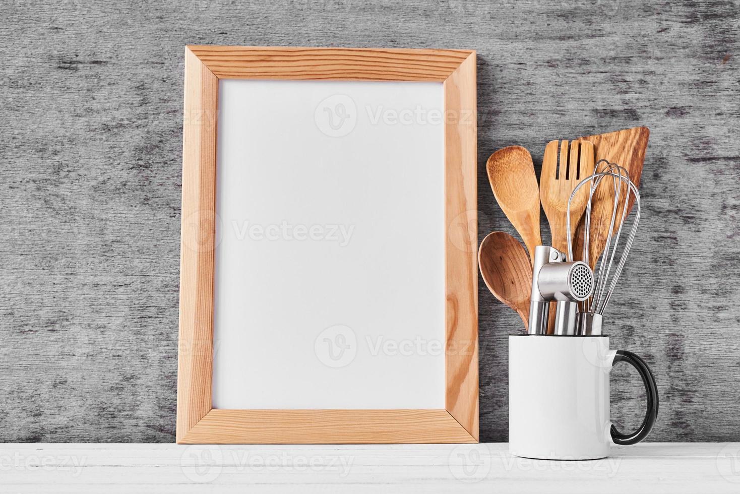 Kitchen utensils and white blank with copy space photo