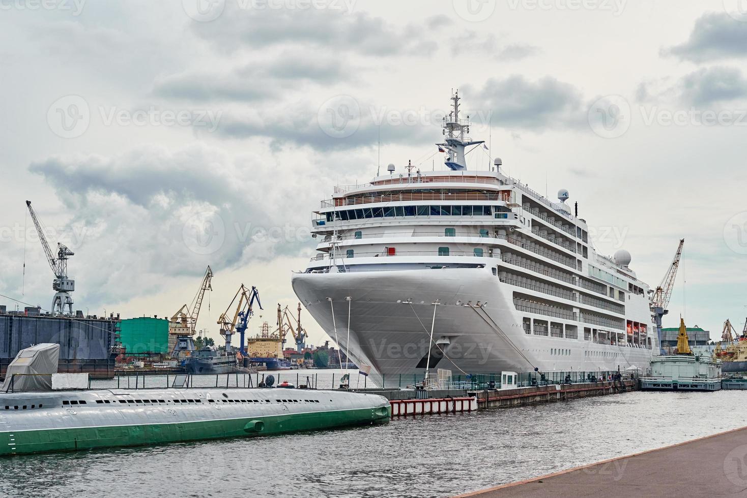 White cruis ship liner docked in the port photo