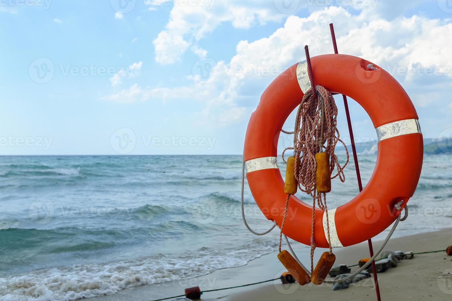 Life preserver on sandy beach somewhere in Black Sea photo