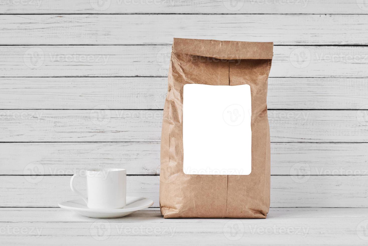 Craft paper bag on white background, copy space photo
