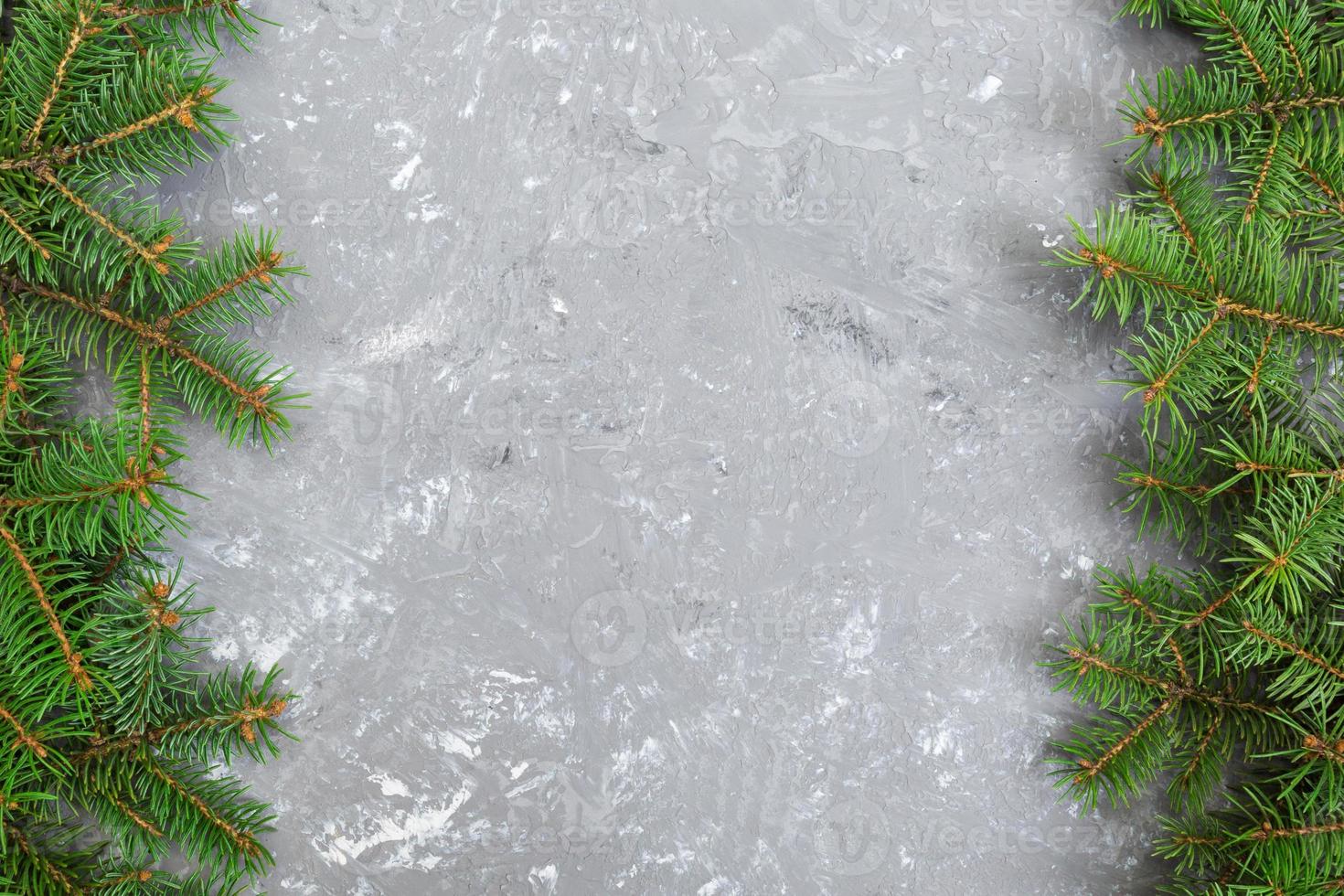 Christmas gray cement background with fir tree and copy space. top view empty space for your design photo