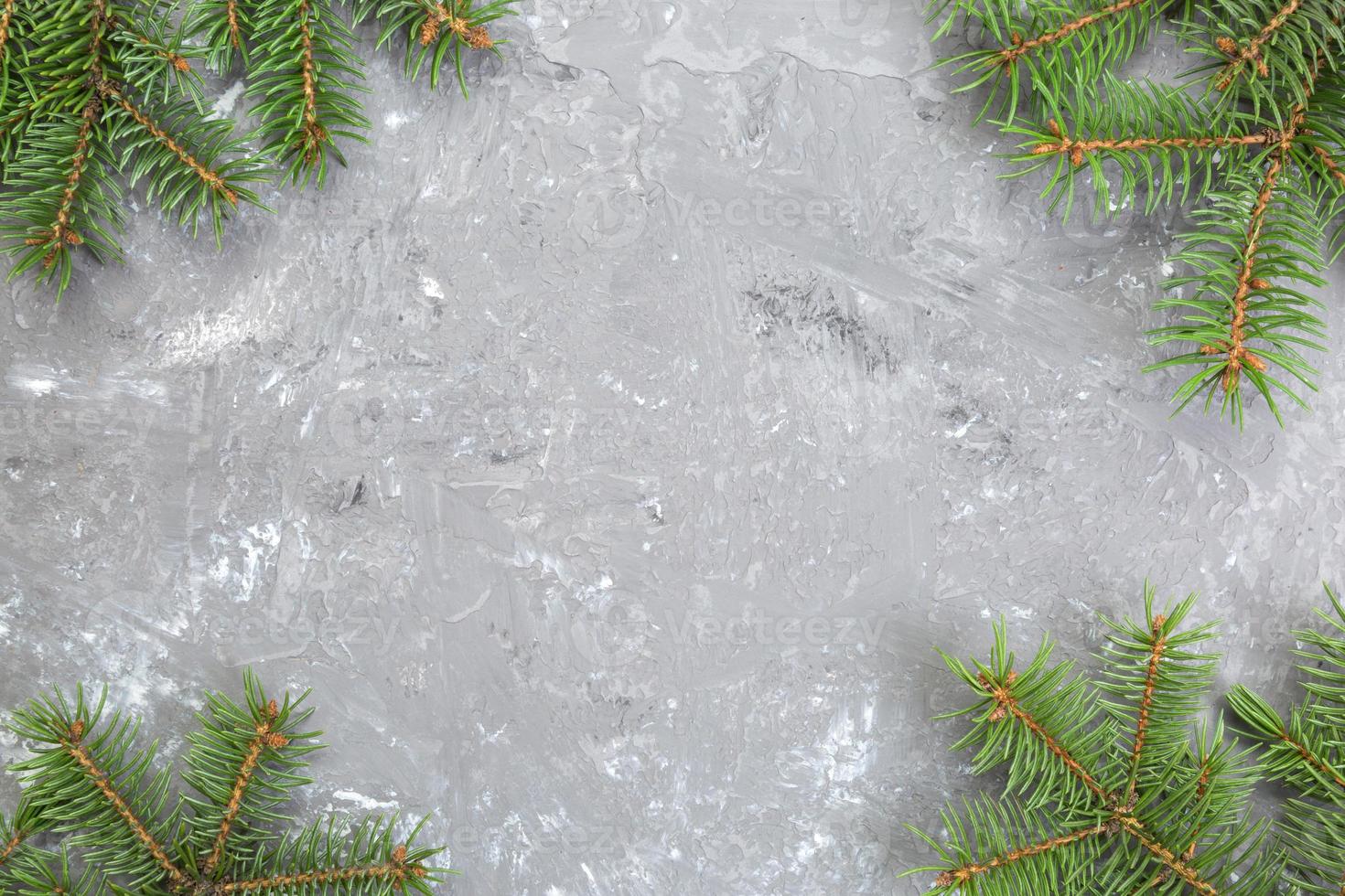Christmas gray cement background with fir tree and copy space. top view empty space for your design photo
