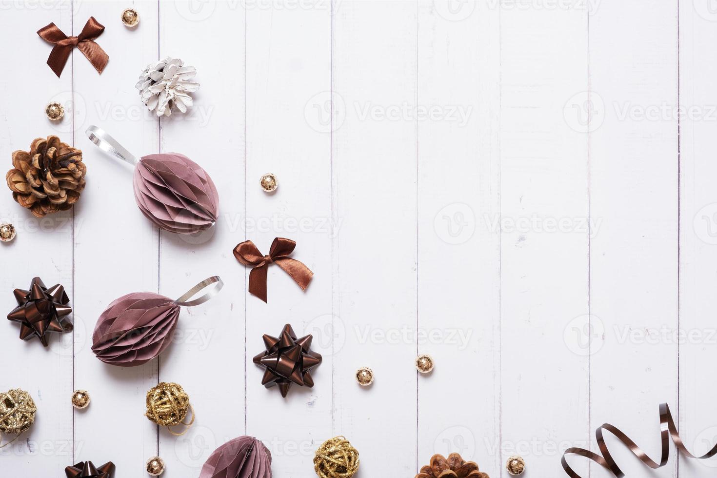 Festive creative christmas composition with paper Christmas balls and other eco friendly decor flat lay on wooden background photo