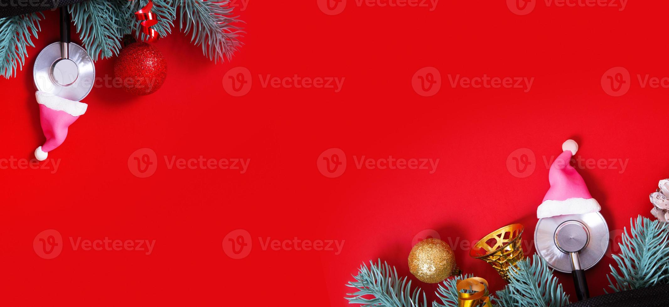 Medical Christmas New Year banner with doctors stethoscope in Santa hat and XMAS decorations top view. Copy space photo