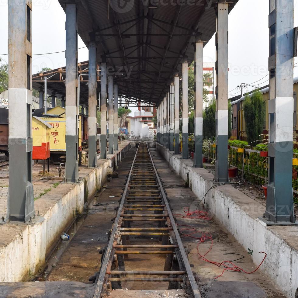 View of Toy train Railway Tracks from the middle during daytime near Kalka railway station in India, Toy train track view, Indian Railway junction, Heavy industry photo