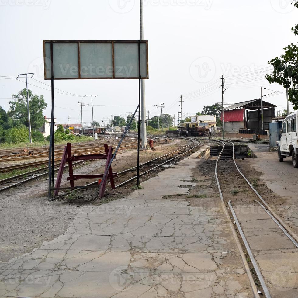 View of Toy train Railway Tracks from the middle during daytime near Kalka railway station in India, Toy train track view, Indian Railway junction, Heavy industry photo