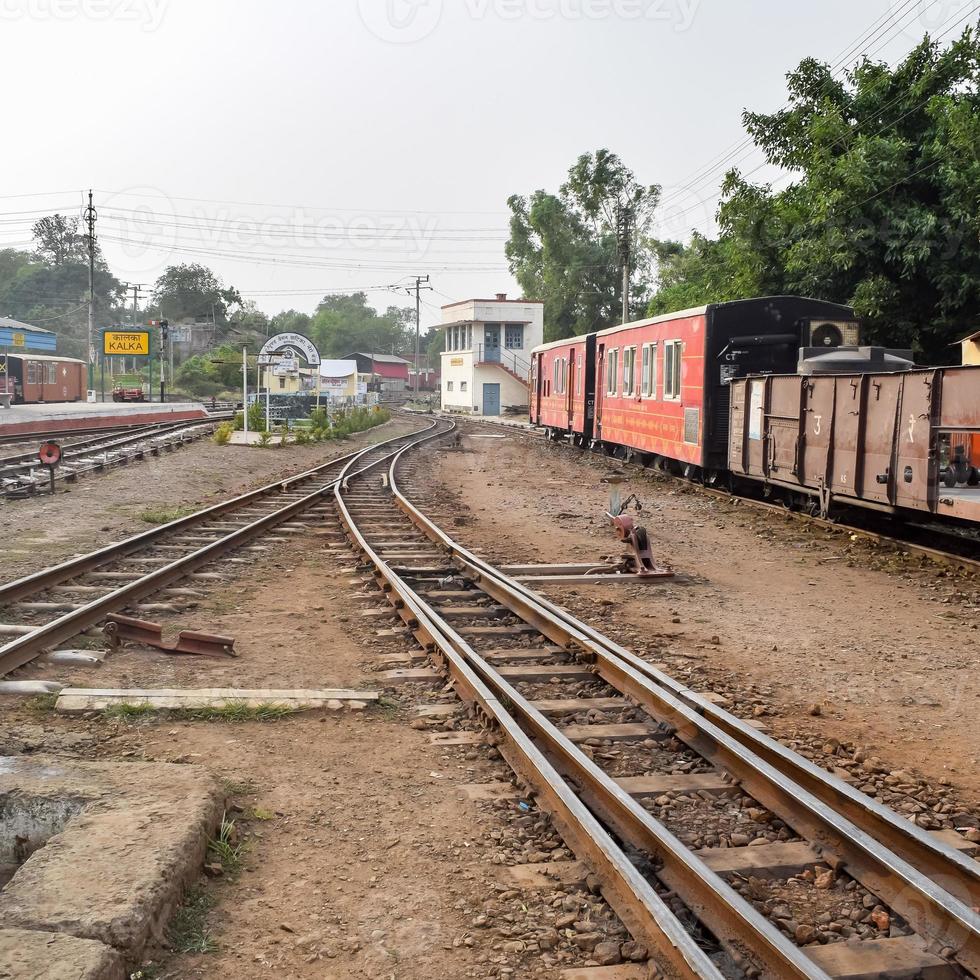 View of Toy train Railway Tracks from the middle during daytime near Kalka railway station in India, Toy train track view, Indian Railway junction, Heavy industry photo