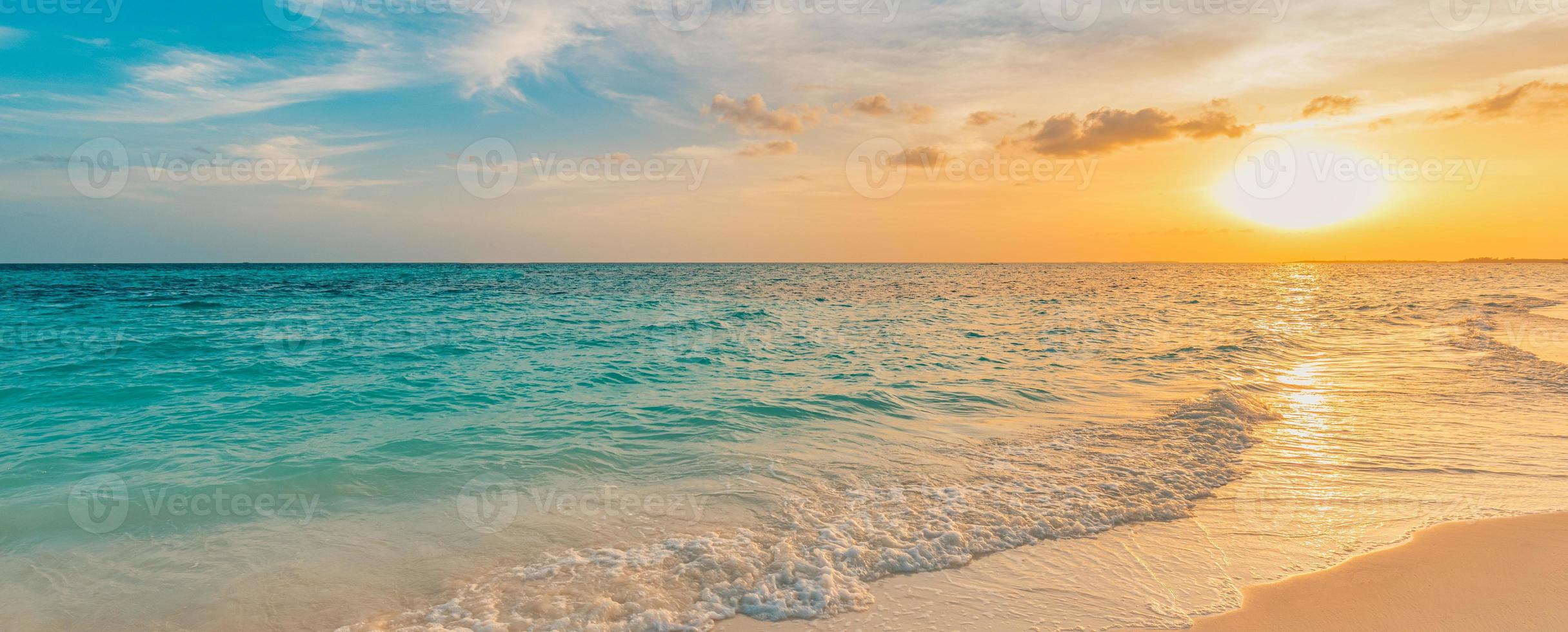 Sea ocean beach sunset sunrise landscape outdoor. Water wave with white foam. Beautiful sunset colorful sky with clouds. Natural island panoramic background. Idyllic amazing tropical island shore photo