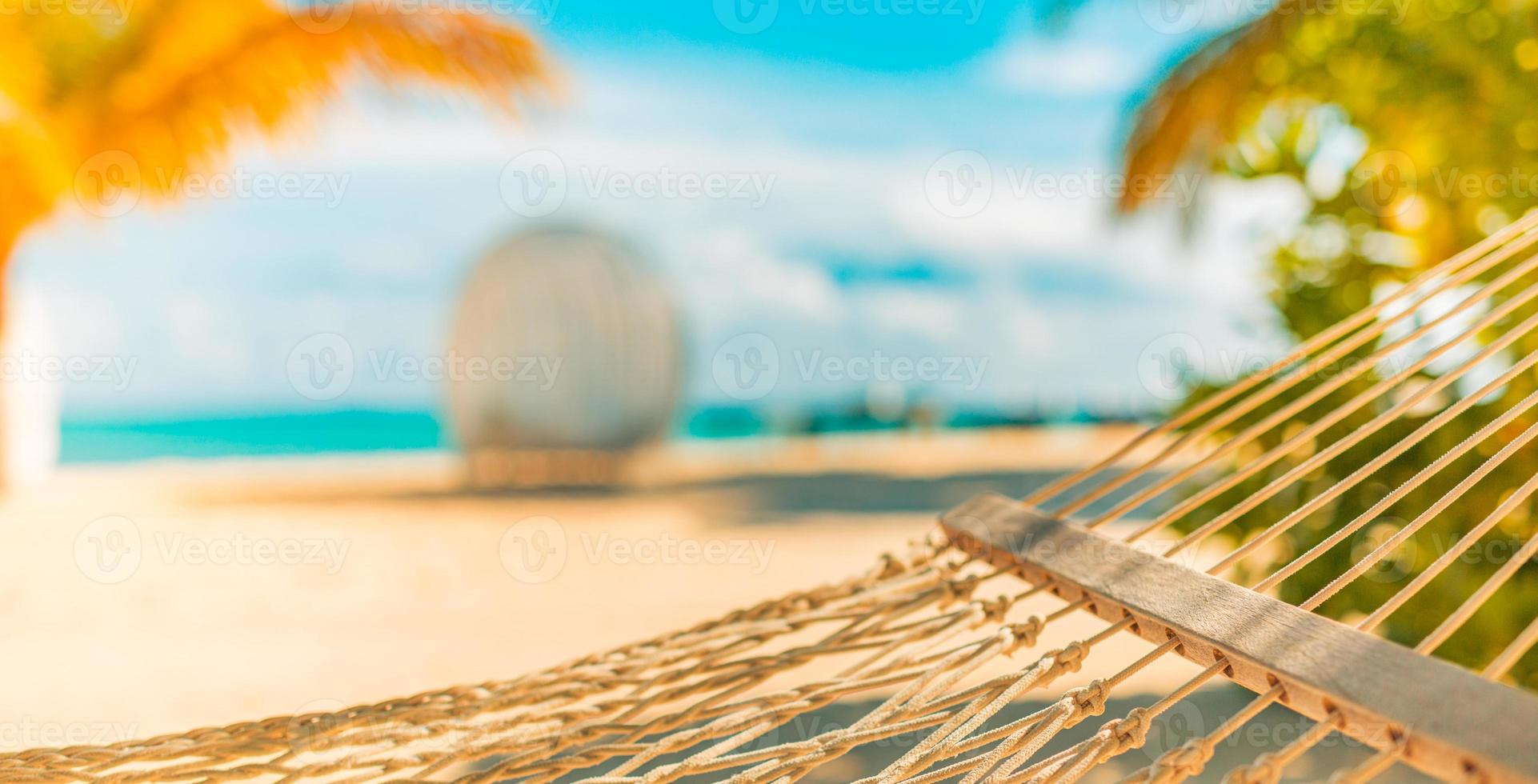 Abstract summer recreation leisure background, closeup hammock with palm leaves, sunny pastel colors, sandy island beach. Dream vacation, freedom relax travel. Exotic beach banner, panoramic view photo