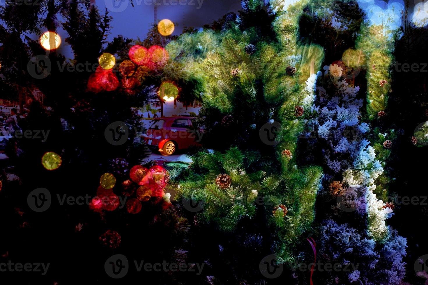 Christmas tree in winter festival, real colorful Christmas backgrounds. Shoes, Deer, gift boxes, snow trees, golden confetti, happy day. photo