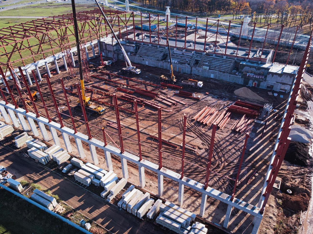 Unfinished metal frame of the building on a concrete base. photo