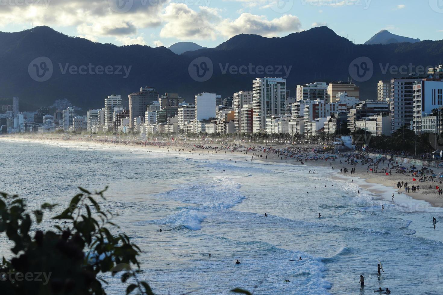 Rio de Janeiro, RJ, Brazil, 2022 - People in silhouette watch the sunset at Arpoador Rock, Ipanema Beach photo