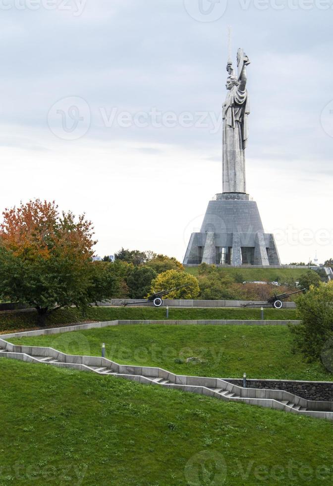 Statue of the Motherland against the blue sky. The fifth largest statue in the world and the highest in Ukraine. Located on the territory of the Museum of the History of Ukraine in World War II. photo