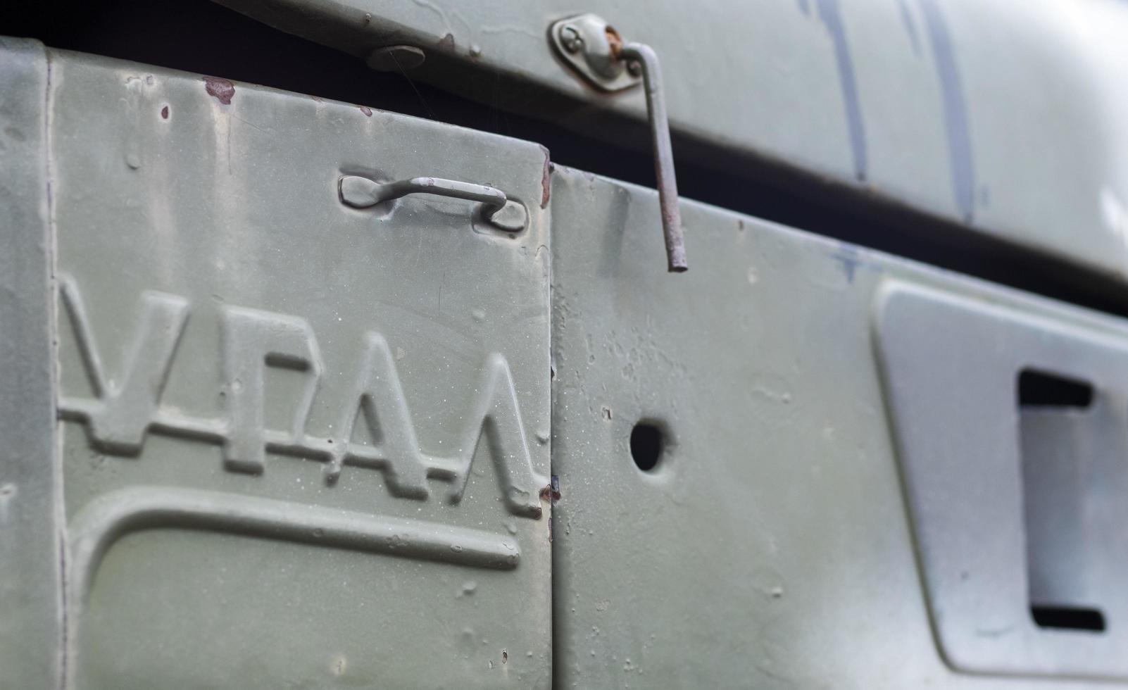 Soviet multiple launch rocket system BM-21 Grad on the chassis of a truck Ural-375D. Broken and burnt military equipment of the Russian Federation. Ural translation. Ukraine, Kyiv - October 8, 2022. photo
