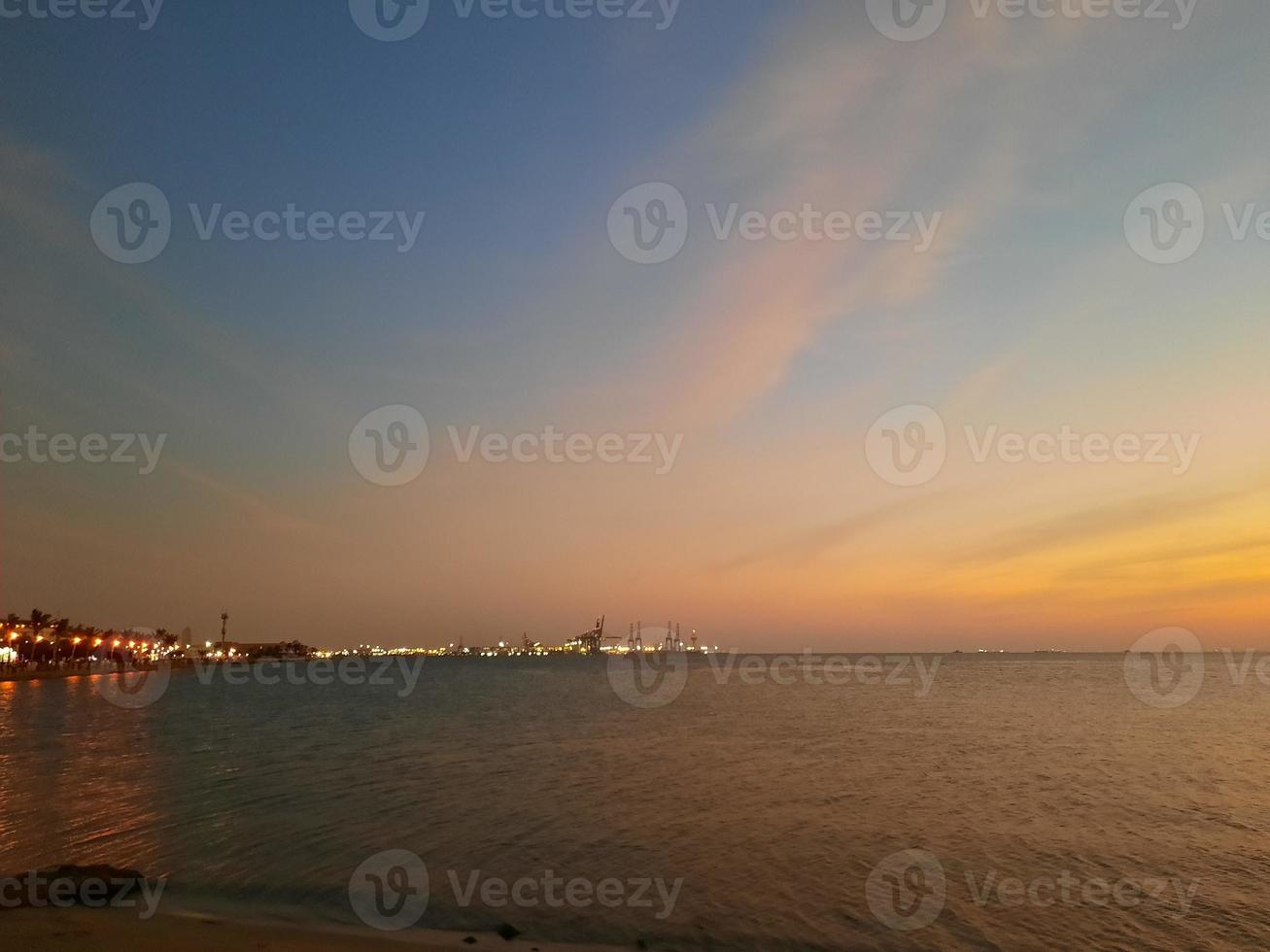 Evening view and sunset from Jeddah beach is very beautiful.  Crowds of people flock to Jeddah Beach to watch the sunset. photo