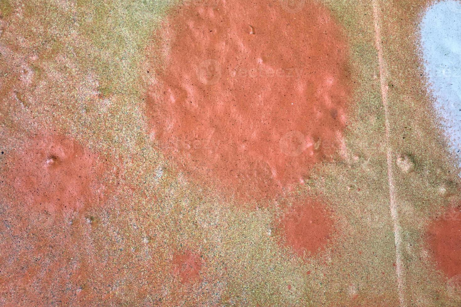 Texture of colorful graffiti paint on conrete and brick walls in red blue purple and silver photo