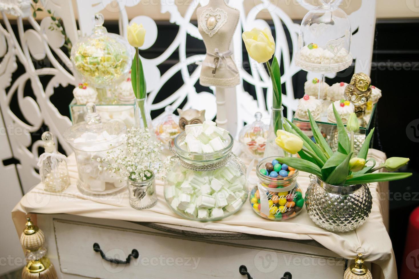 Wedding candy bar with yellow tulips photo