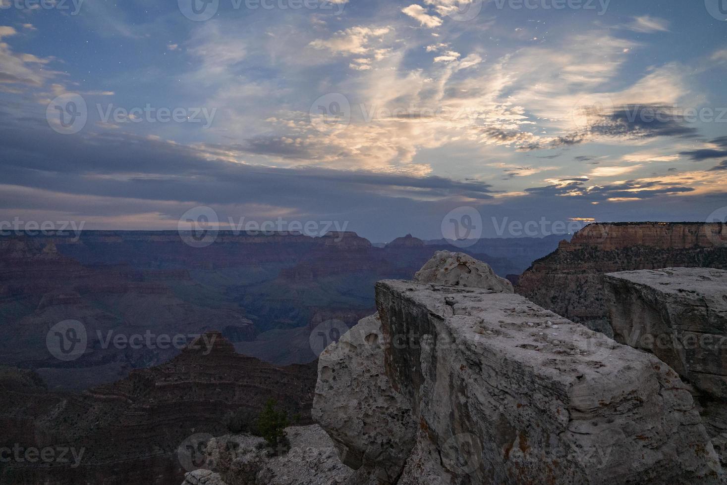 Scenic View Of Rock Formations And Mountains under cloudy sky photo