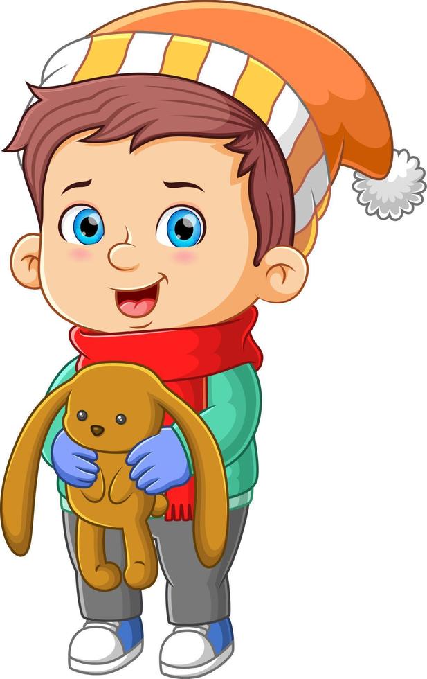 The cute boy is holding the favorite doll in the christmas night vector
