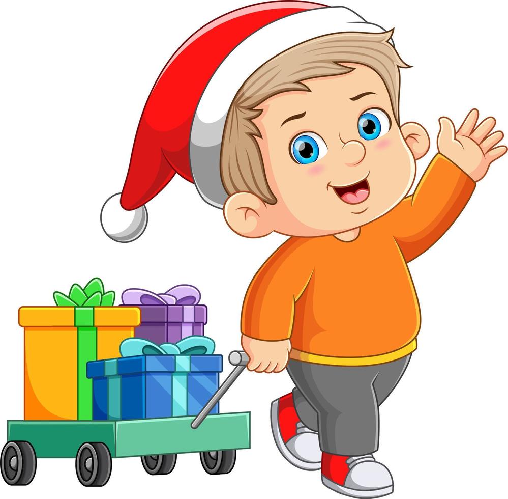 el chico lindo está saludando y mostrando un montón de regalos en el carrito vector