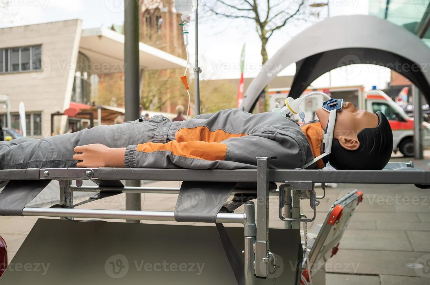 training emergency mannequin lies in a public place on the street photo