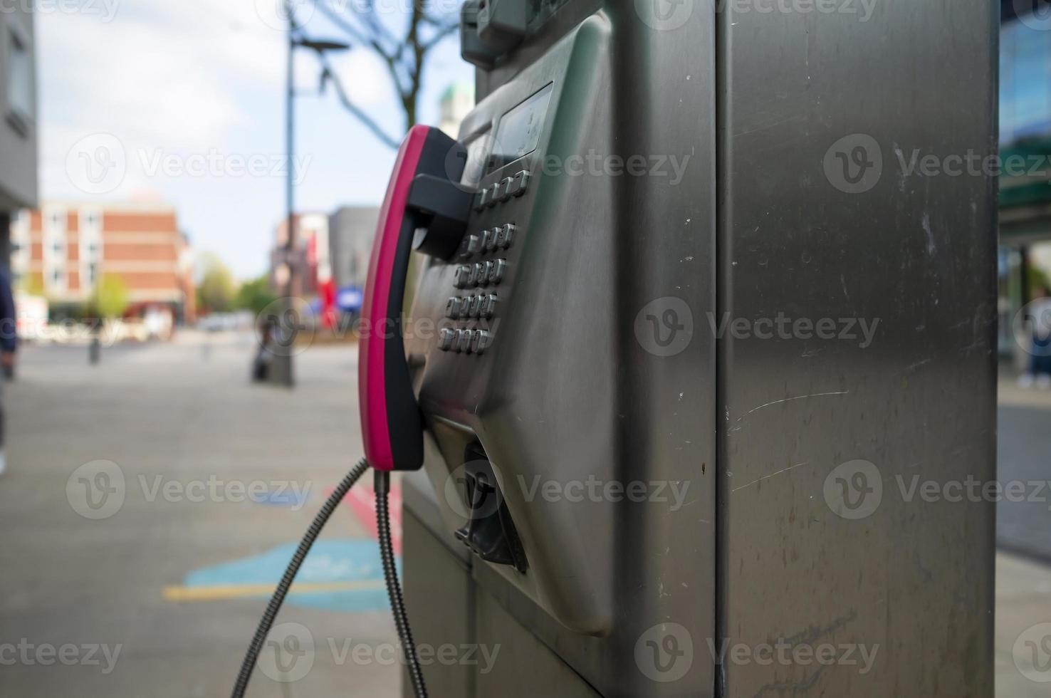 public phone on the street in european city photo