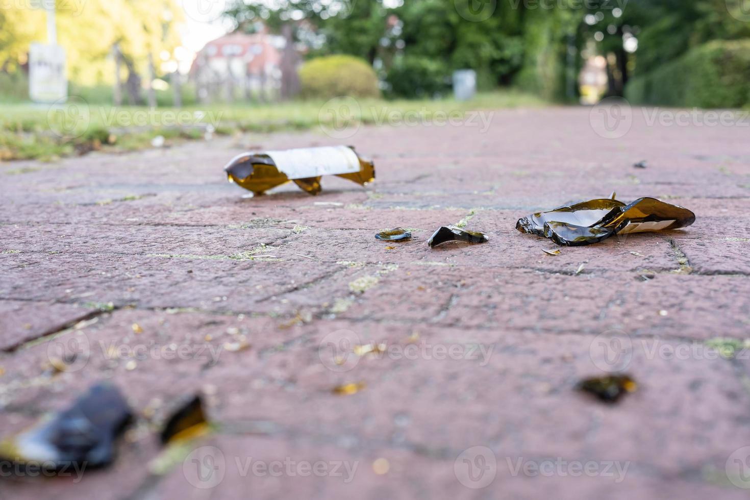 Broken glass bottles on the road after a student booze photo