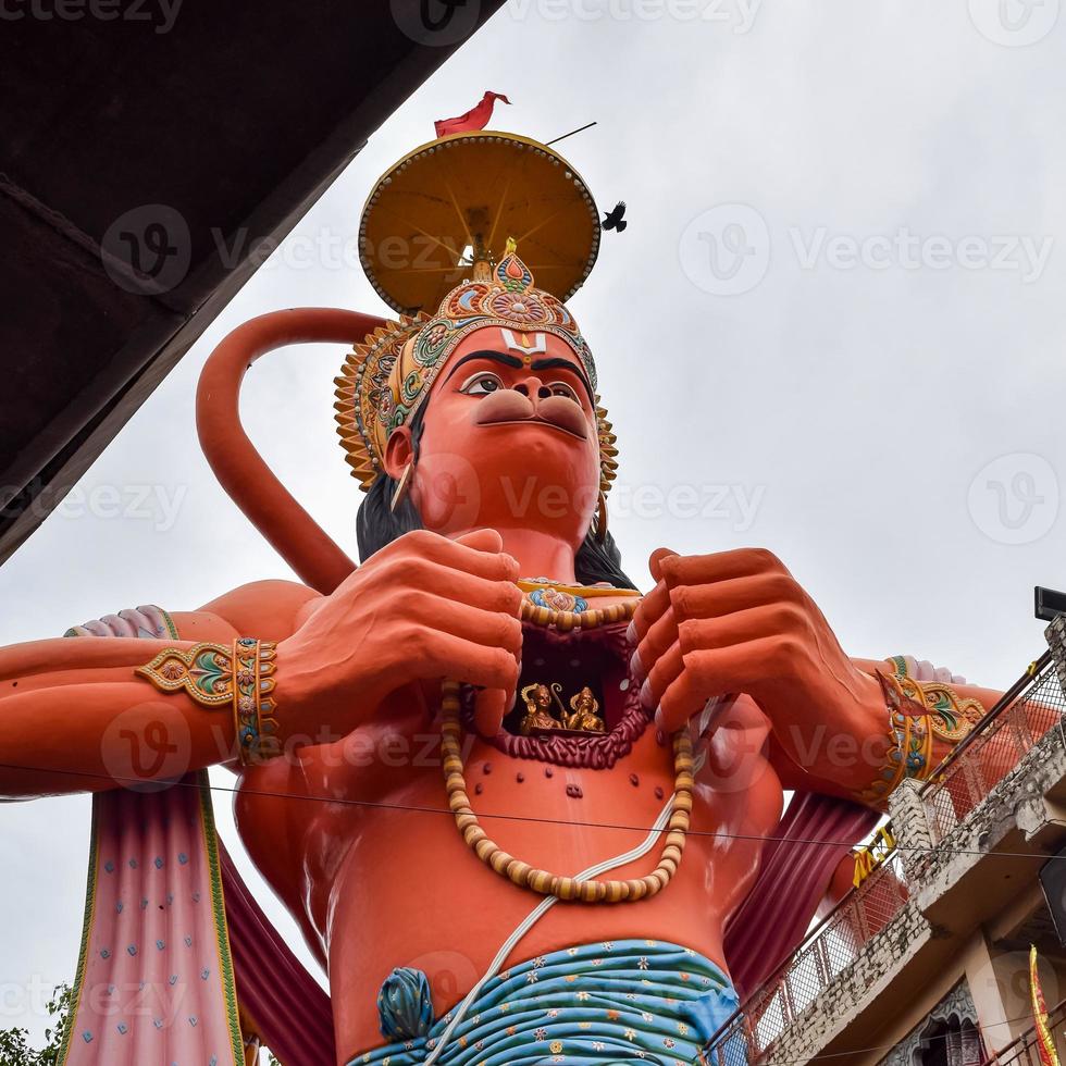 Big statue of Lord Hanuman near the delhi metro bridge situated near Karol Bagh, Delhi, India, Lord Hanuman big statue touching sky photo