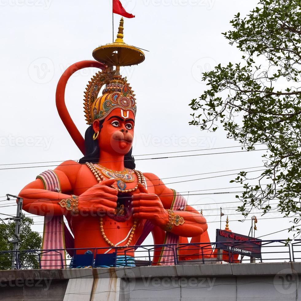 Big statue of Lord Hanuman near the delhi metro bridge situated near Karol Bagh, Delhi, India, Lord Hanuman big statue touching sky photo