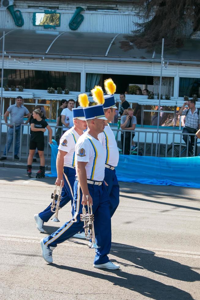 Dnipro, Ukraine - 09.11.2021 Citizens celebrate City Day. An orchestra of musicians with wind instruments dressed as hussars on a city street. photo