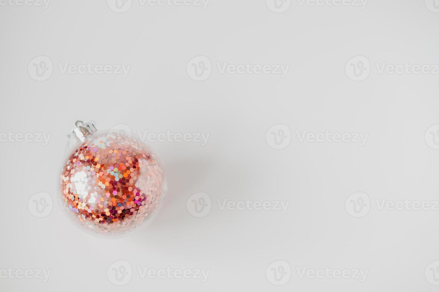 red shiny new year ball, close-up, isolated on white background Concept of family celebration of Christmas and New Year. photo