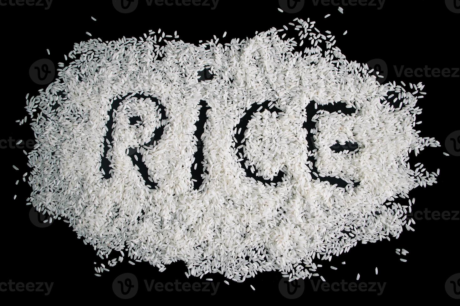 Pile of uncooked white rice on black background. photo