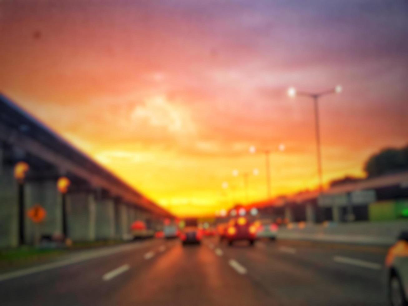 Defocused blurred abstract background of traffic jam at night in east Jakarta. The rear view, the red and yellow lights or the brake lights of the cars are on. photo