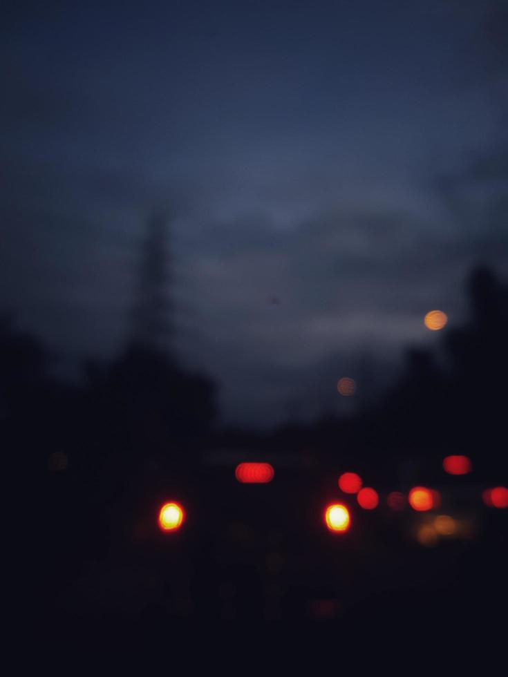 Defocused blurred abstract background of traffic jam at night in east Jakarta. photo