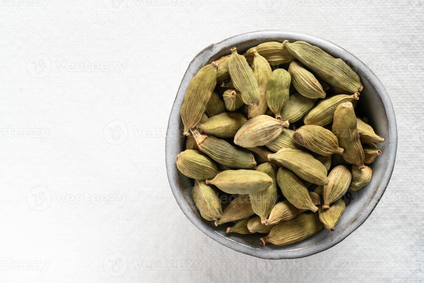 Green Cardamom Pods in a Bowl photo