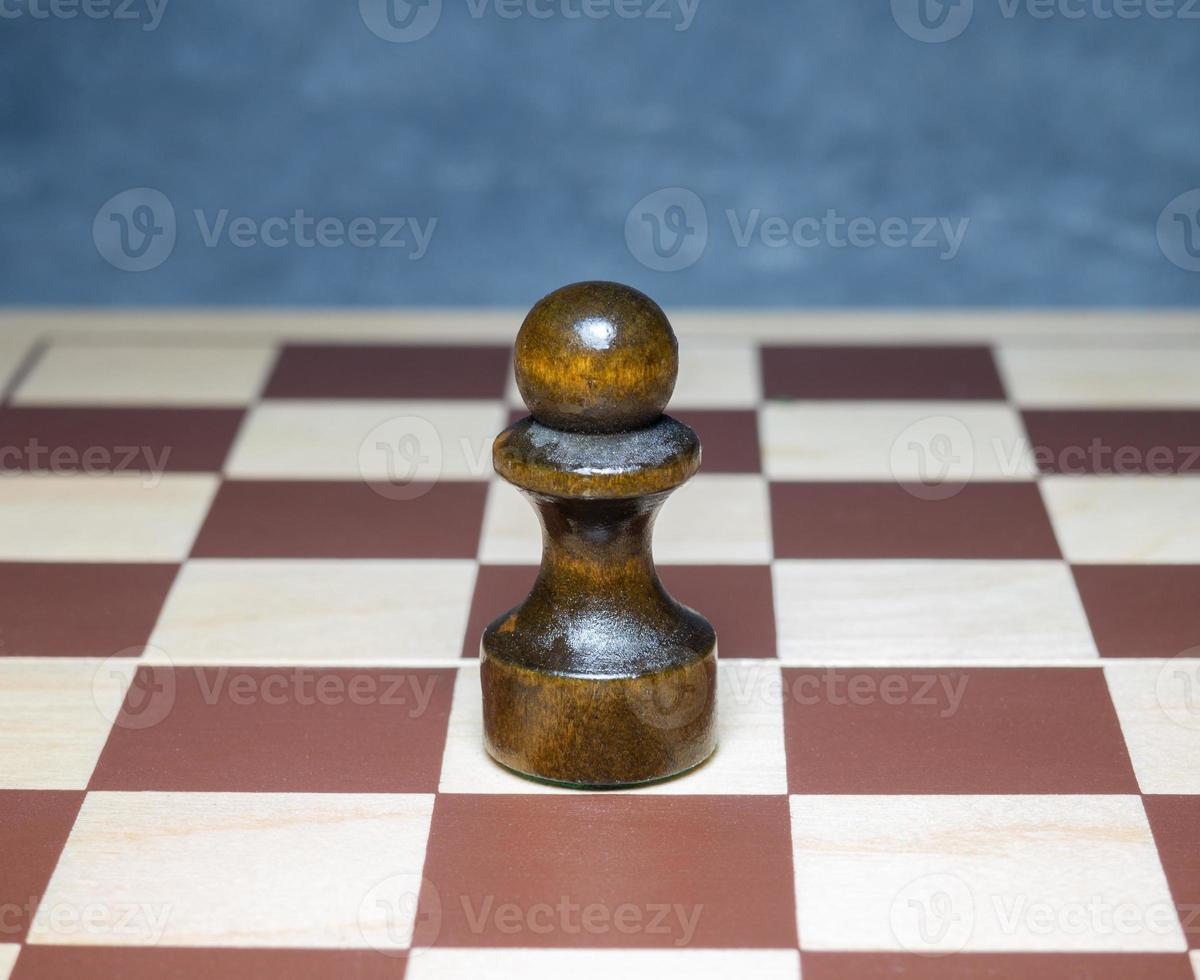 Chess board with figures. Wooden chess. Board games. Location of opponents. Counter strategy. Pawn photo