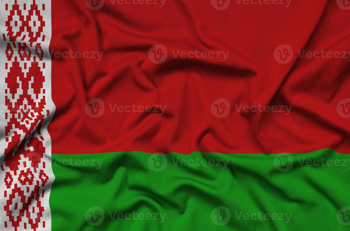 Belarus flag is depicted on a sports cloth fabric with many folds. Sport team banner photo