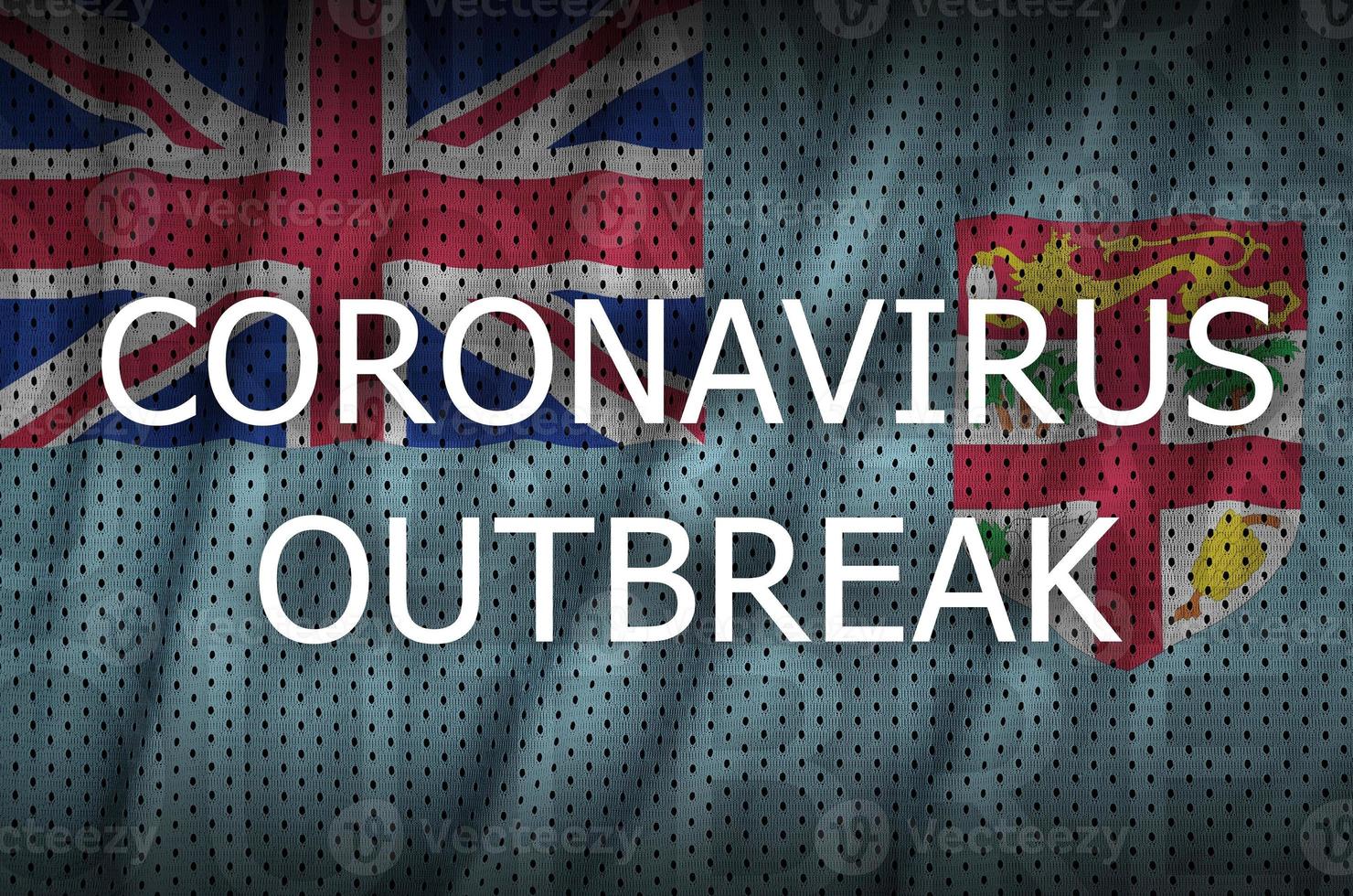 Fiji flag and Coronavirus outbreak inscription. Covid-19 or 2019-nCov virus photo