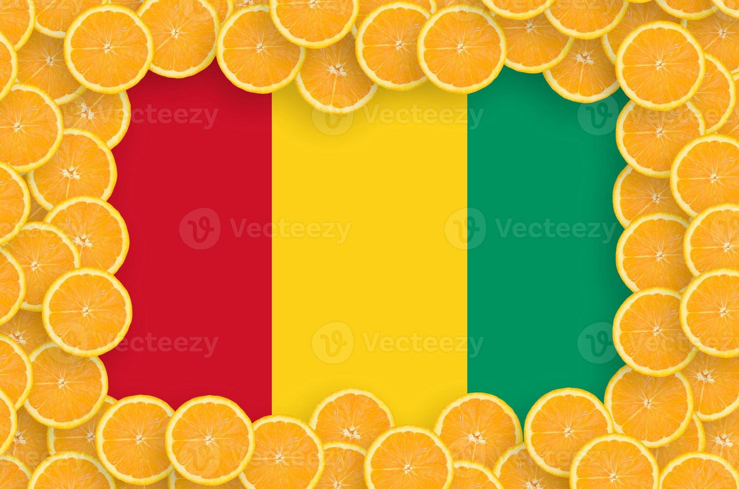 Guinea flag in fresh citrus fruit slices frame photo