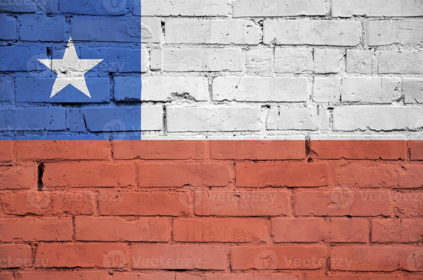 Chile flag is painted onto an old brick wall photo