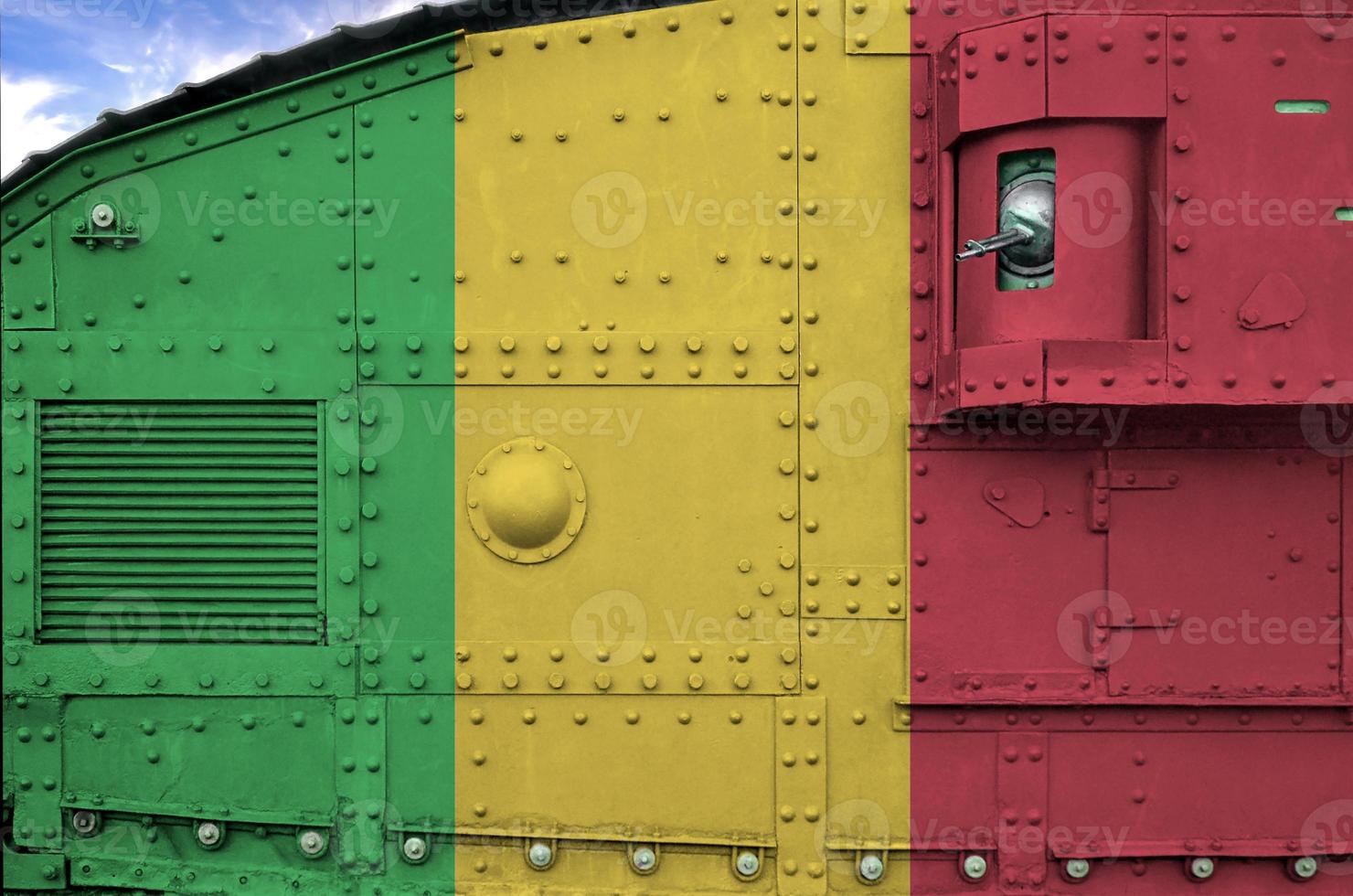 Mali flag depicted on side part of military armored tank closeup. Army forces conceptual background photo