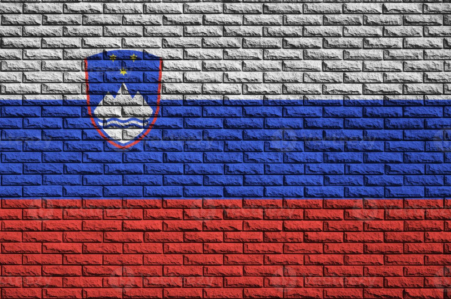 Slovenia flag is painted onto an old brick wall photo