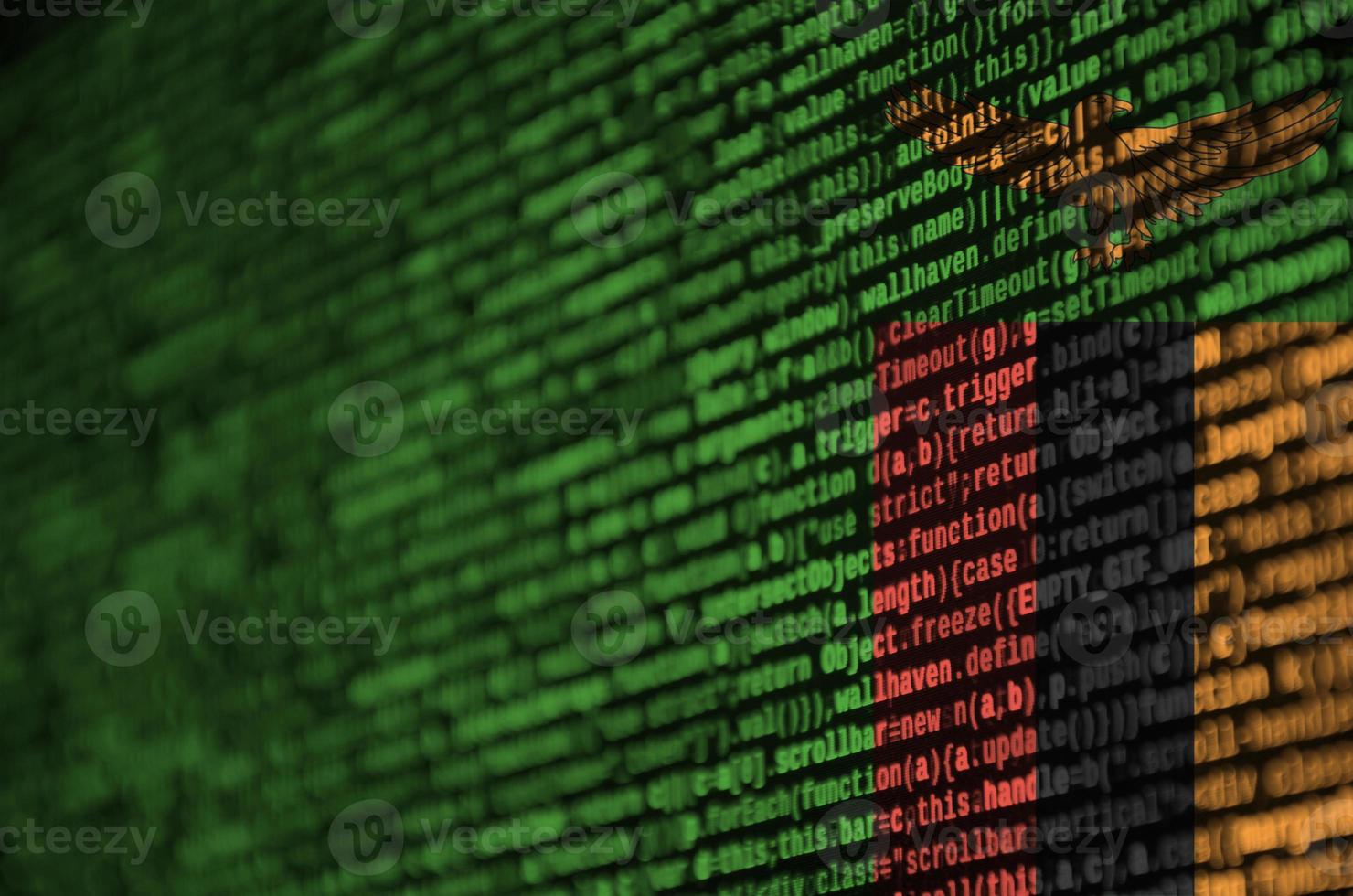 Zambia flag is depicted on the screen with the program code. The concept of modern technology and site development photo