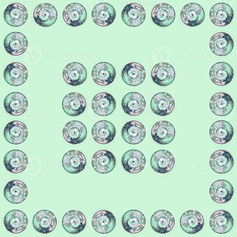 Many used spray cans for graffiti drawing lies on a pastel colored backgroung. Street art painting concept. Minimal flat lay pattern. Top view photo