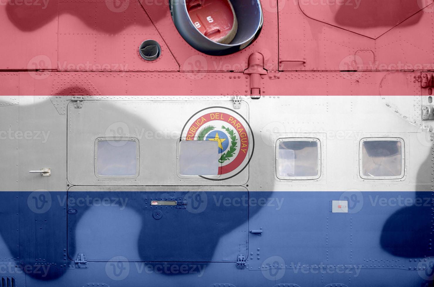 Paraguay flag depicted on side part of military armored helicopter closeup. Army forces aircraft conceptual background photo