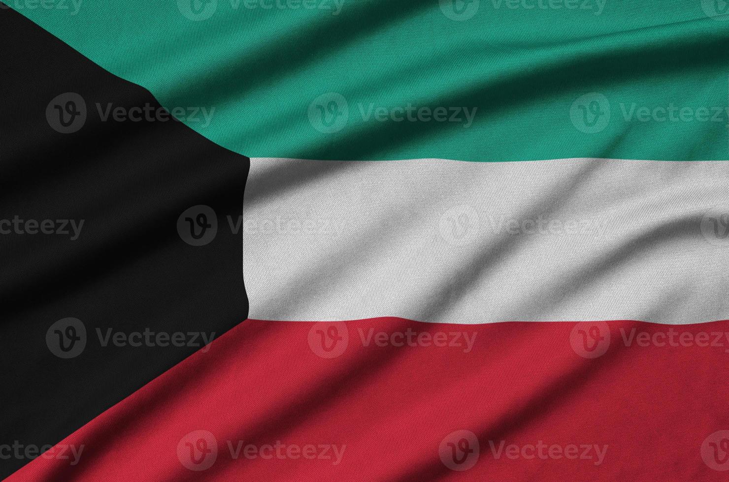 Kuwait flag is depicted on a sports cloth fabric with many folds. Sport team banner photo