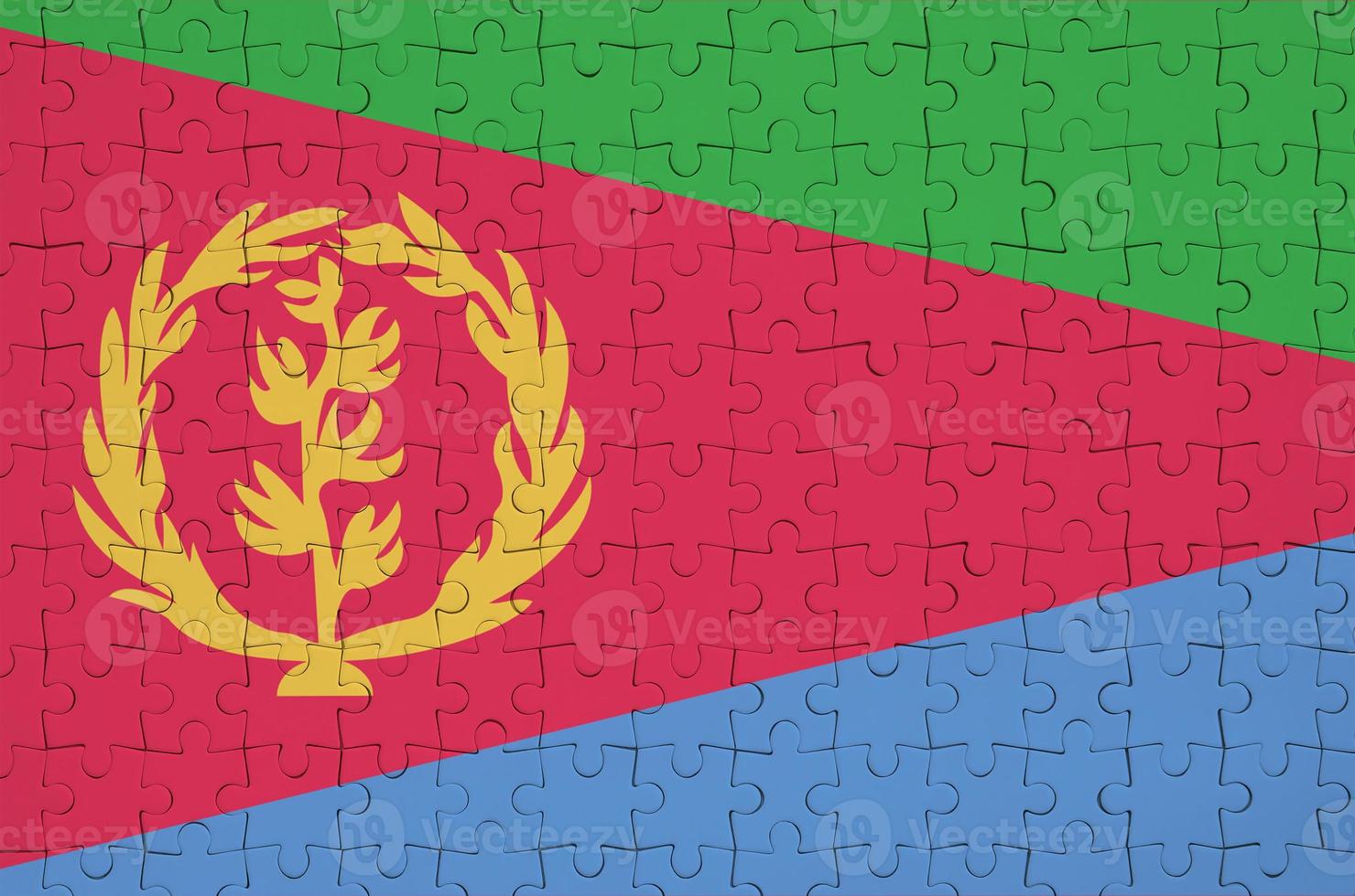Eritrea flag is depicted on a folded puzzle photo