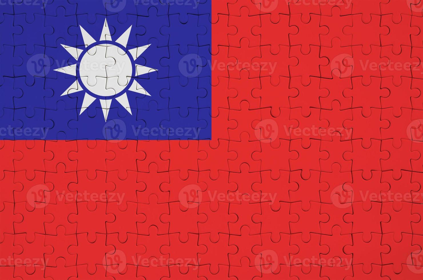 Taiwan flag is depicted on a folded puzzle photo